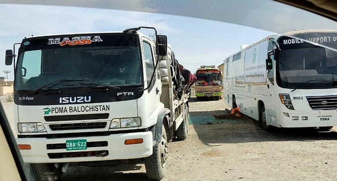 Mobile medical screening unit and cargo trucks park at the closed Pakistan-Iran border crossing, Feb. 25, 2020, in Taftan, Pakistan. (AP)