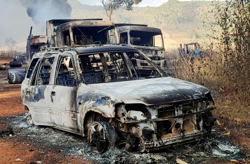In this photo provided by the Karenni Nationalities Defense Force (KNDF), vehicles smolder in Hpruso township, Kayah state, Myanmar, Friday, Dec. 24, 2021. (AP)