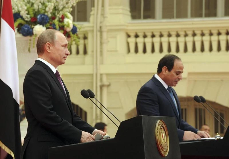 Russia's President Vladimir Putin listens to his Egyptian counterpart Abdel Fattah al-Sisi at a news conference after their meeting in Cairo February 10, 2015. (Reuters)