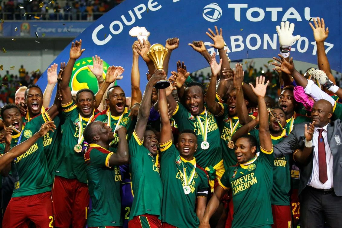 Cameroon’s Benjamin Moukandjo celebrates with the trophy and teammates after winning the African Cup of Nations in 2017. (Reuters)