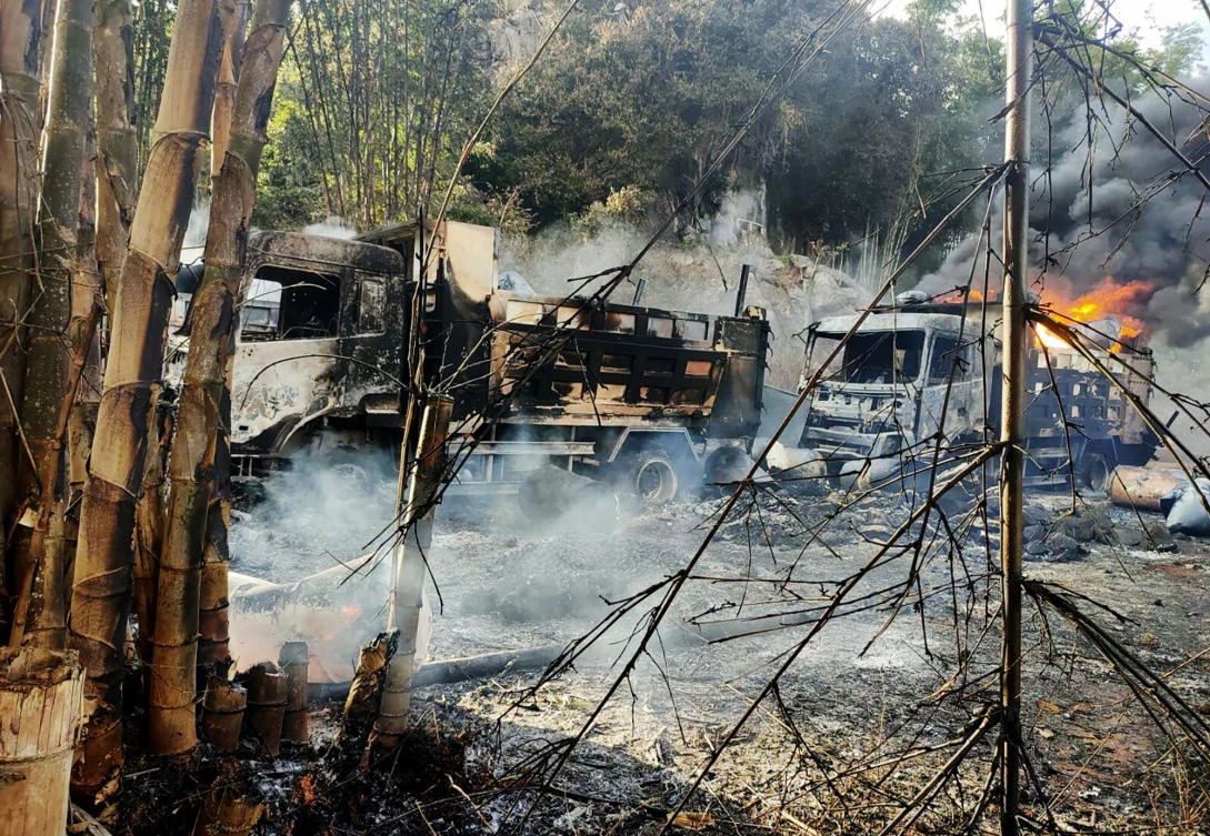 In this photo provided by the Karenni Nationalities Defense Force, smokes and flames billow from vehicles in Hpruso township, Kayah state, Myanmar on Friday. (AP)