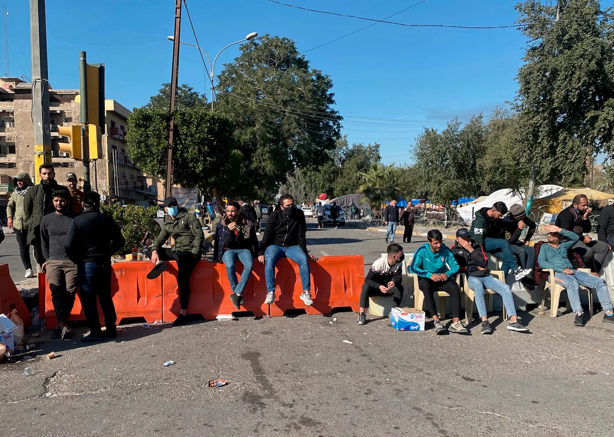 Protesters denouncing election results gather outside the heavily fortified Green Zone in Baghdad, Iraq, Monday, Dec. 27, 2021. (AP)