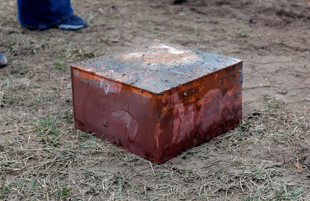Workers recover a box believed to be the 1887 time capsule that was put under Confederate Gen. Robert E. Lee's statue pedestal in Richmond, Va., Monday, Dec. 27, 2021. (AP)
