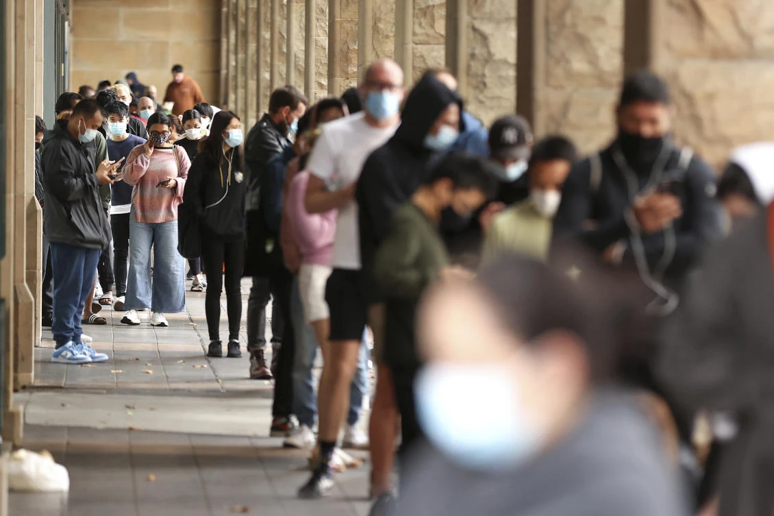 The omicron variant began to spread in Australia just as the country got underway with plans to reopen for good after nearly two years of stop-start lockdowns. (AAP Image via AP)
