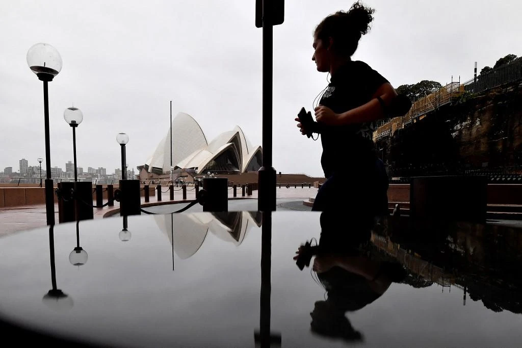 New infections in Sydney, above, and surrounding parts of New South Wales state skyrocketed to more than 11,000, up from 6,000 a day earlier. (AFP)