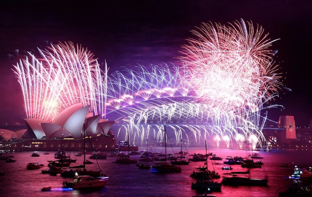 World rings in New Year under COVID-19 cloud