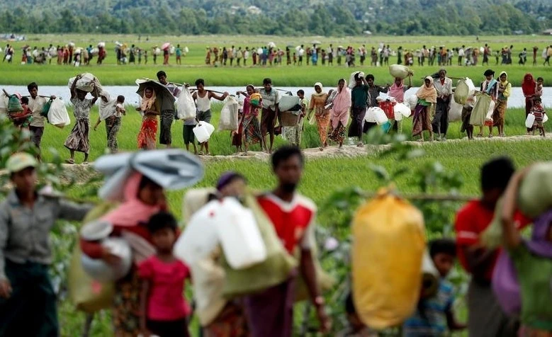 Rohingya, after crossing the border from Myanmar, walk to refugee camps, Palang Khali, near Cox’s Bazar, Bangladesh, Oct. 2017. (Reuters)