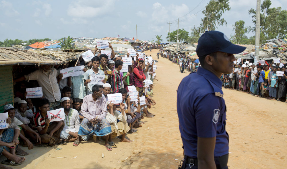 In this April 29, 2018 file photo, Rohingya refugees holing placards, await the arrival of a U.N. Security Council team at the Kutupalong Rohingya refugee camp in Kutupalong, Bangladesh. (AP)