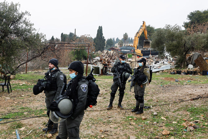 Members of the Israeli border police stand guard near the demolished home of the Salhiye family, east Jerusalem, Jan. 19, 2022. (Reuters)