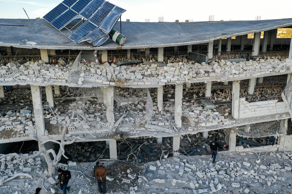 This picture taken on January 3, 2022 shows an aerial view of a poultry farm hit by air strikes near the town of Kafr Takharim in Syria's rebel-held northwestern Idlib province. (AFP)