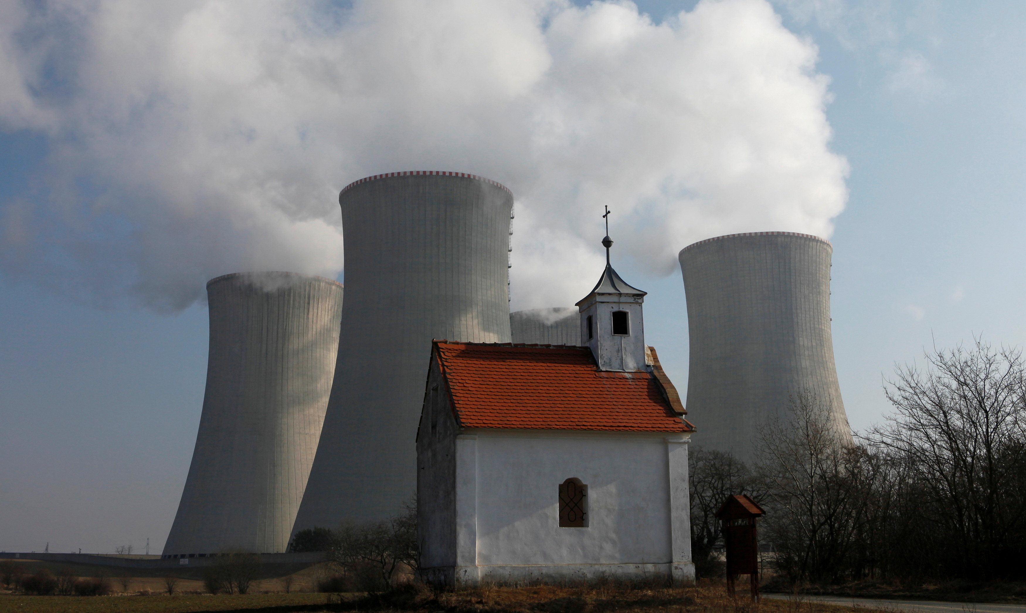 A chapel is seen in front of the cooling towers of the Czech nuclear power plant at Dukovany, 200 kms east of Prague, March 15, 2011. (Reuters)