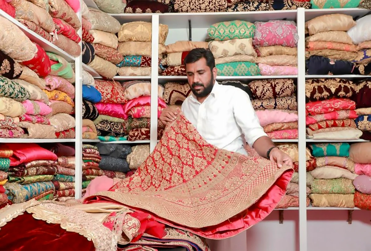 Indian taxi driver’s ‘dress bank’ saves poor brides from financial ruin
