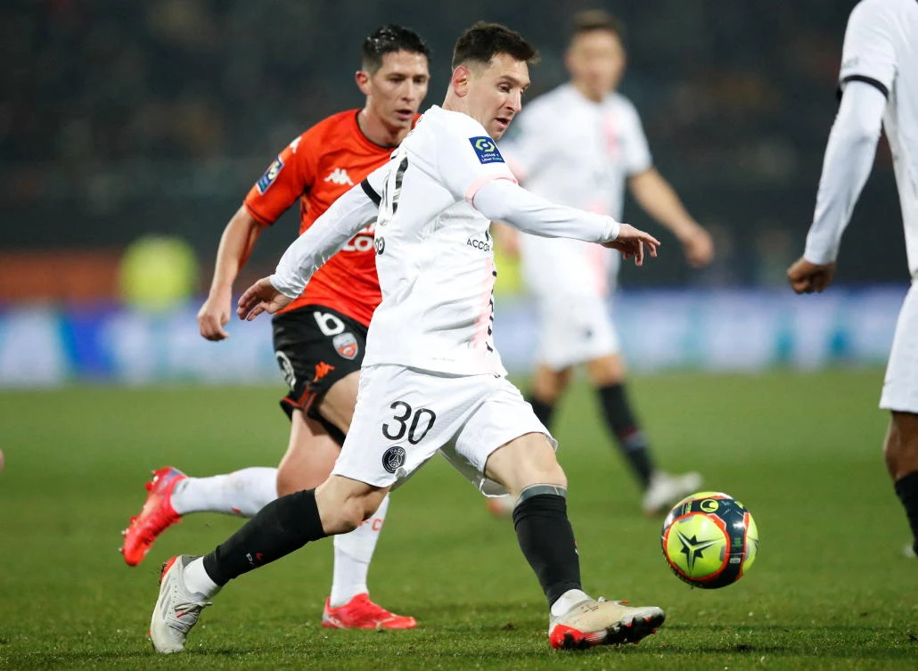 FILE PHOTO: Paris St Germain's Lionel Messi in action with Lorient's Laurent Abergel (Reuters)