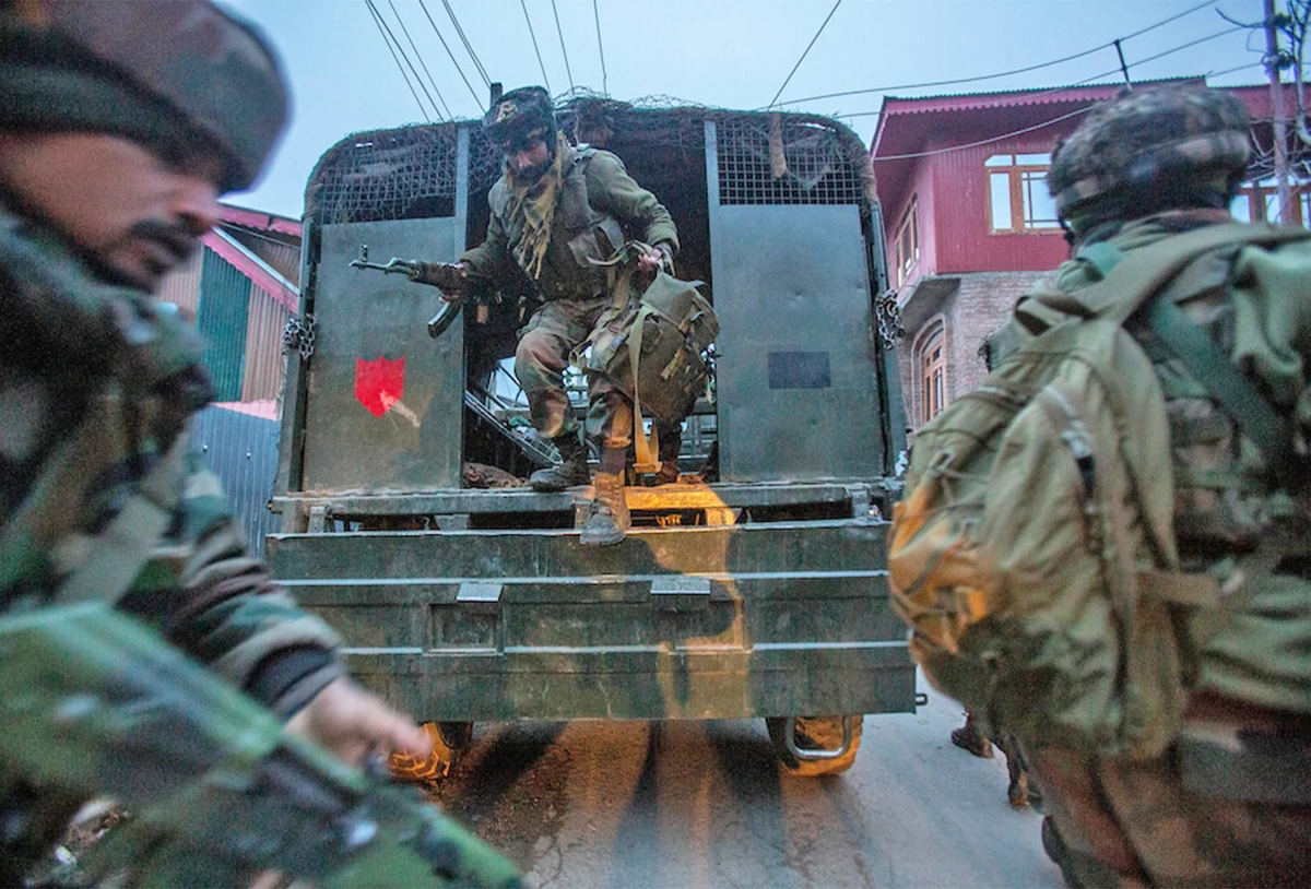 Indian army soldiers arrive during a counterinsurgency operation on the outskirts of Srinagar, Indian controlled Kashmir, on January 3, 2022. (AP)