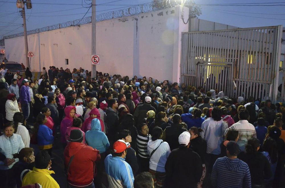 In this Feb. 11, 2016 file photo, relatives of inmates stand outside the Topo Chico prison, where a riot broke out overnight in Monterrey, Mexico. On Saturday, 56 inmates were injured at Apodaca prison, just outside Monterrey.(AP File Photo)