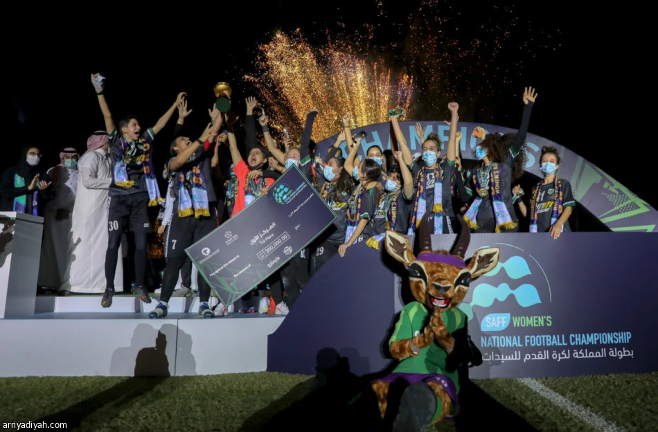 Al-Mamlaka players celebrate being crowned winners of the National Football Championship (SAFF)