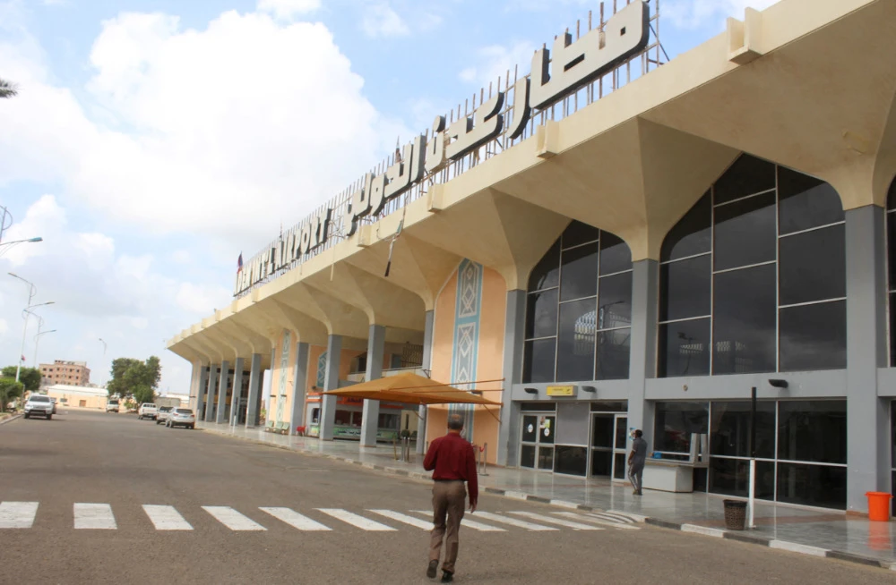 A man walks to the airport building in Yemen's southern city of Aden on January 3, 2021. (AFP)