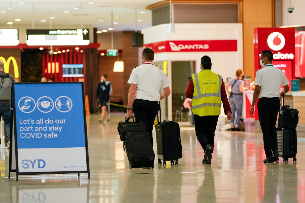 A flight crew walk through the terminal at Sydney Airport, Monday, Nov. 29, 2021. (AP)