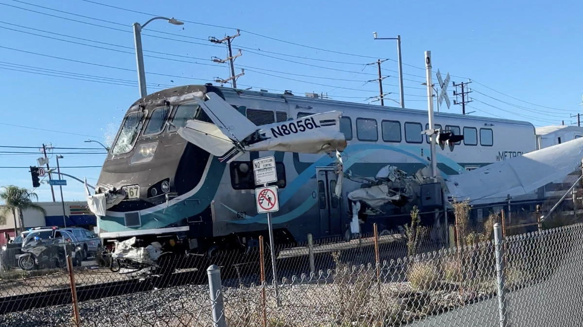 A train hits an aircraft that crashed on railway tracks in Los Angeles, California, US January 9, 2022 in this screen grab from a social media video obtained by Reuters. (Reuters)
