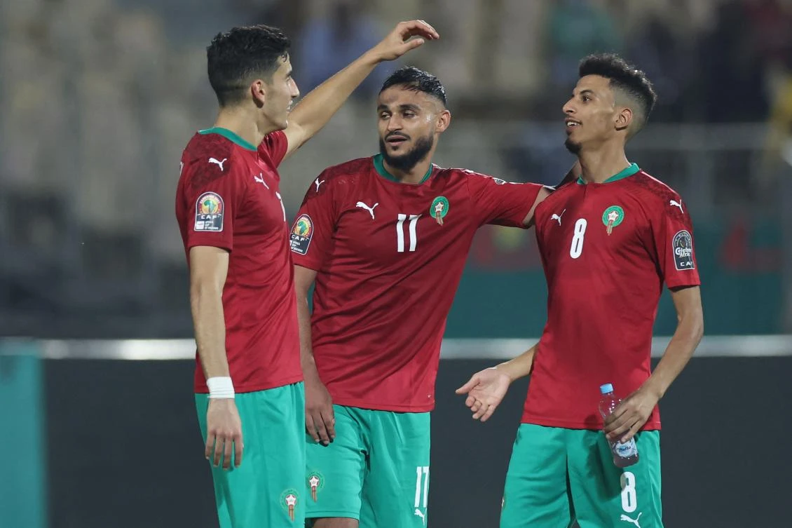 Morocco’s forward Sofiane Boufal (C) is congratulated by teammates after scoring in the match between Morrocco and Ghana in Yaounde, on January 10, 2022. (AFP)