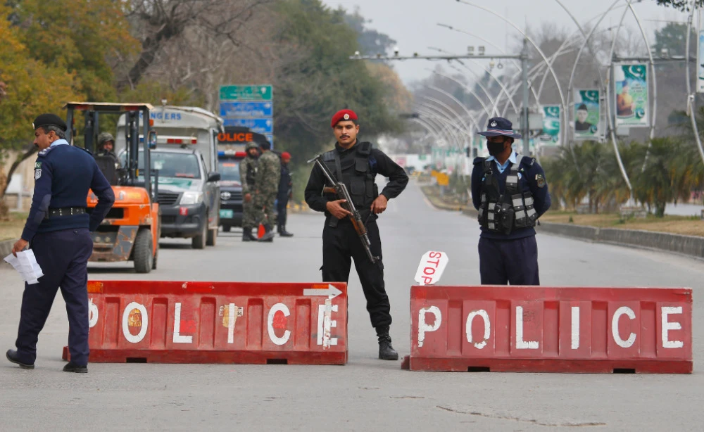 Pakistani police commandos and paramilitary soldiers stand guard at a highway in Islamabad, Pakistan. (AP file photo)
