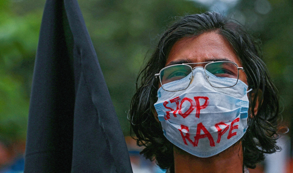 A student holds a black flag to protest against an alleged gang-rape and torturing of a woman in the southern district of Noakhali during a demonstration in Dhaka, Bangladesh, on October 6, 2020. (AFP/File)
