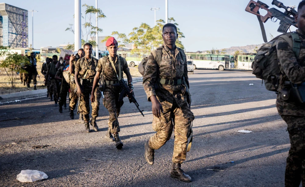 Soldiers from the Ethiopian National Defence Force (ENDF) walk in the streets of Kombolcha, Ethiopia. (AFP file photo)
