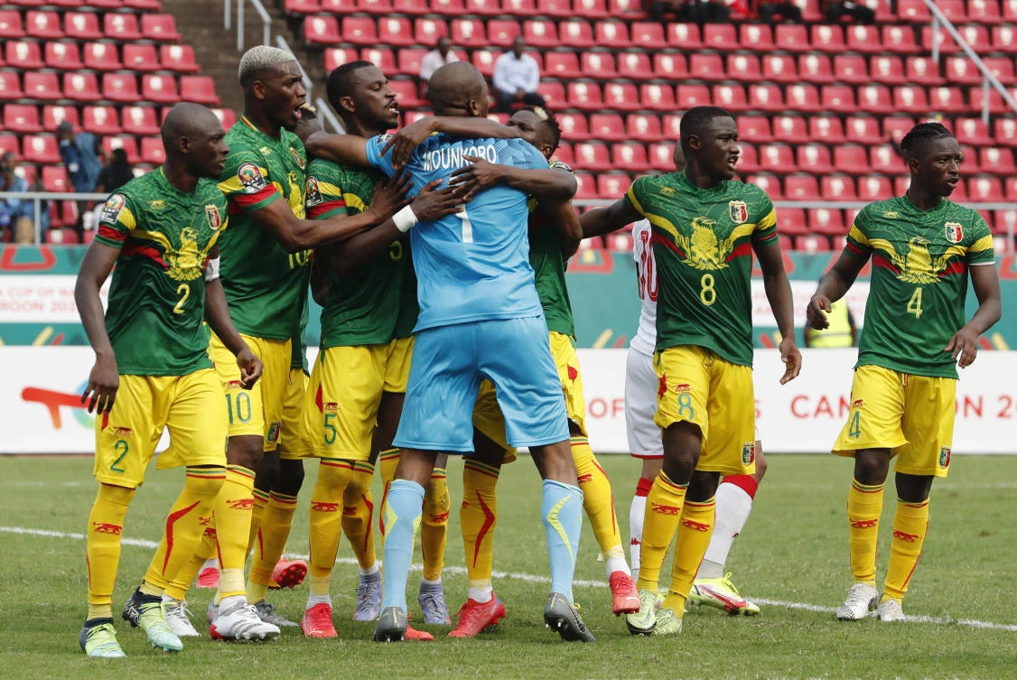 Mali's Ibrahim Mounkoro celebrates with teammates after saving a penalty from Tunisia's Wahbi Khazri during their Africa Cup of Nations match at Limbe Omnisport Stadium, Cameroon on Wednesday. (Reuters)
