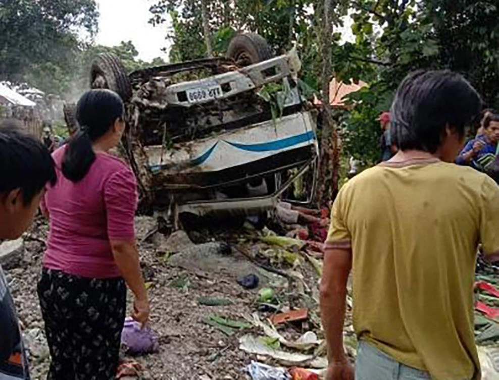 The vehicle was traveling to a beachside resort on Mindanao island for a postponed Christmas party on Wednesday when the driver lost control after the brakes apparently failed on a downhill section of road. (AFP)
