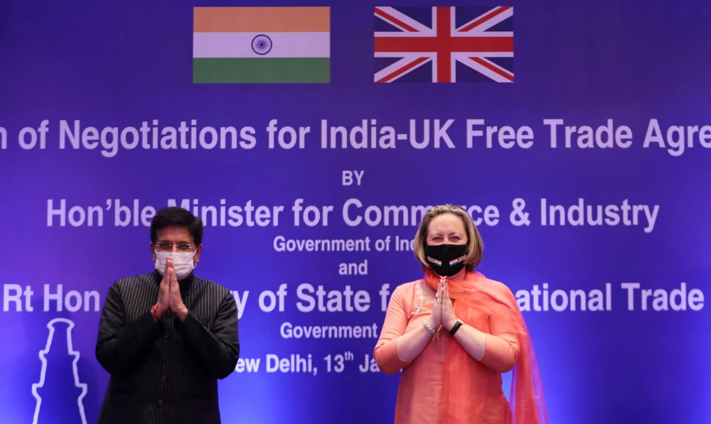India's Minister of Commerce and Industry, Piyush Goyal, and British Secretary of State for International Trade Anne-Marie Trevelyan pose for a picture during the launch of free trade agreement negotiations in New Delhi on Thursday. (Reuters)