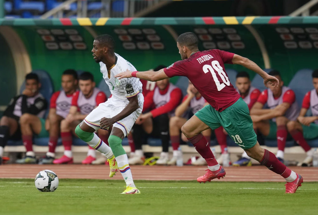 Comoros’ Faiz Selemani gets the ball away from Morocco’s Tarik Tissoudali, during their African Cup of Nations 2022 group C match, at the Ahmadou Ahidjo stadium in Yaounde on Friday. (AP)
