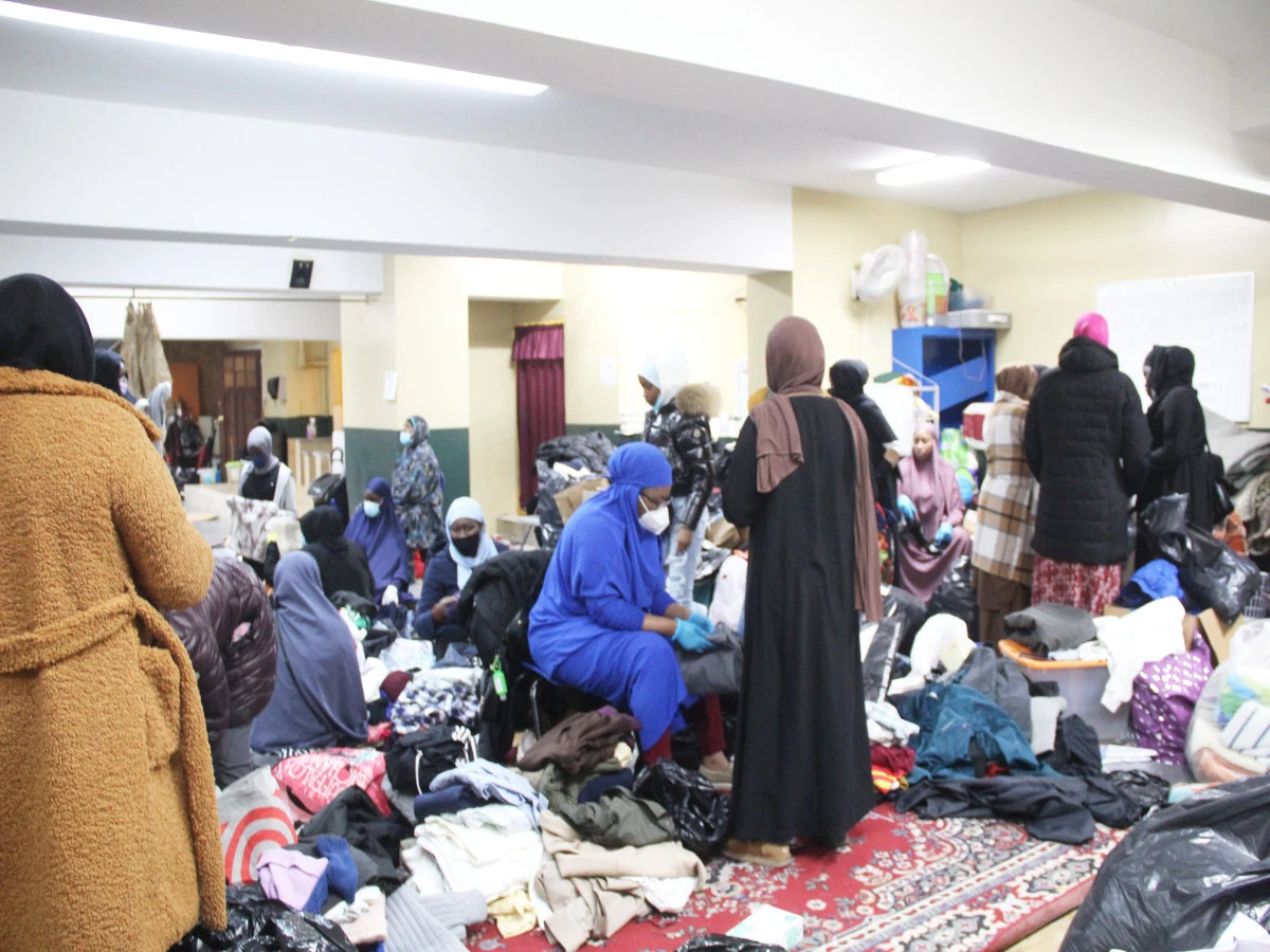 Muslim women gather to organize donated clothes and distribute them to victims of the fatal Bronx fire at Masjid Al-Rahama in the Bronx, New York. (Supplied)