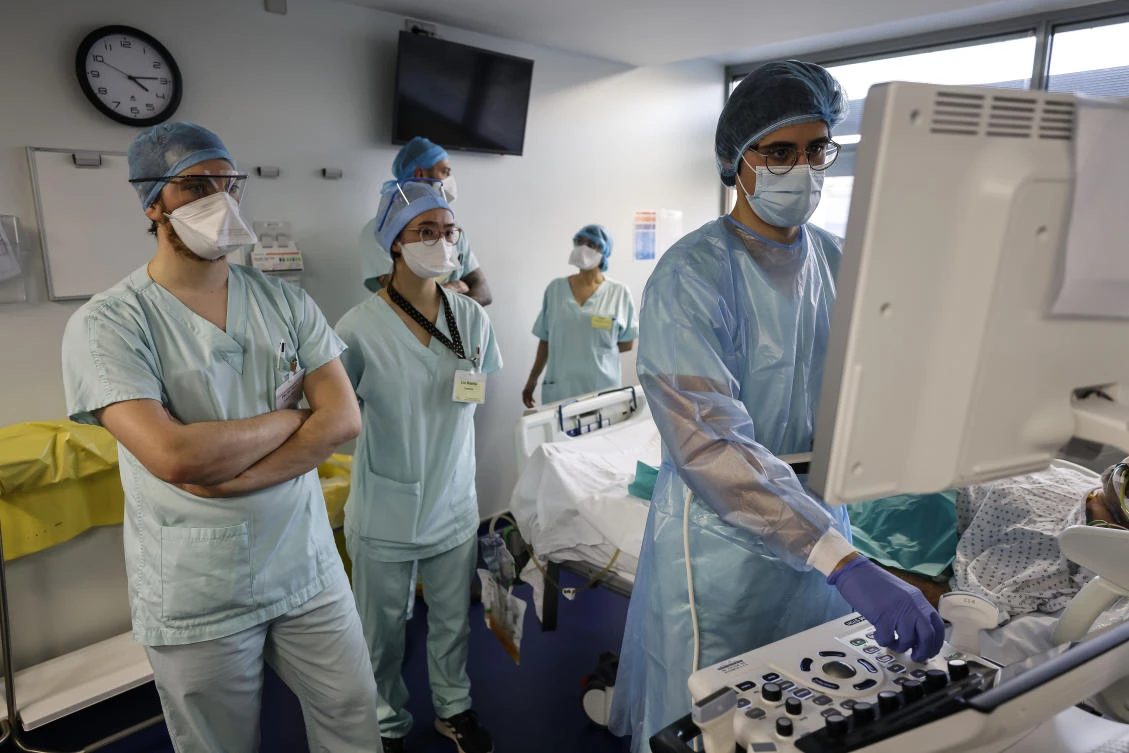 Medical staff members care for a COVID-19 patient in the intensive care unit at the Strasbourg University Hospital, eastern France, Thursday Jan. 13, 2022. (AP)