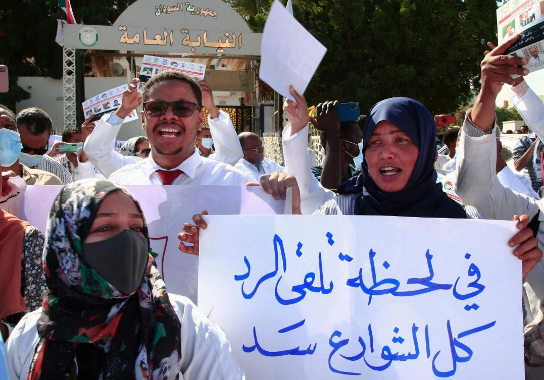 Dozens of Sudanese doctors demonstrate in Khartoum on January 16, 2022 to denounce attacks by security forces against medical personnel and doctors during pro-democracy rallies opposed to the October military coup. (File/AFP)