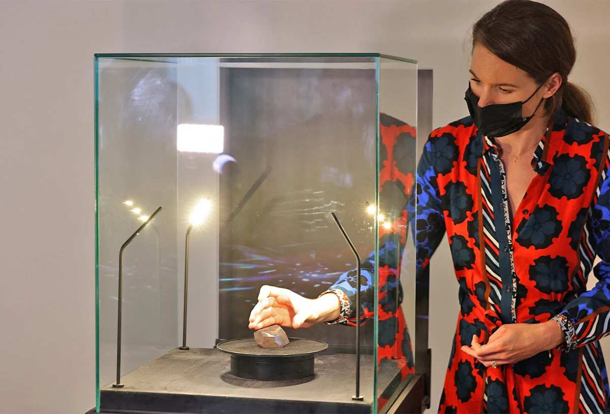 A picture taken on January 17, 2022 shows "The Enigma", a 555.55 carat black diamond, at Sotheby's in the Gulf emirate of Dubai. (AFP)