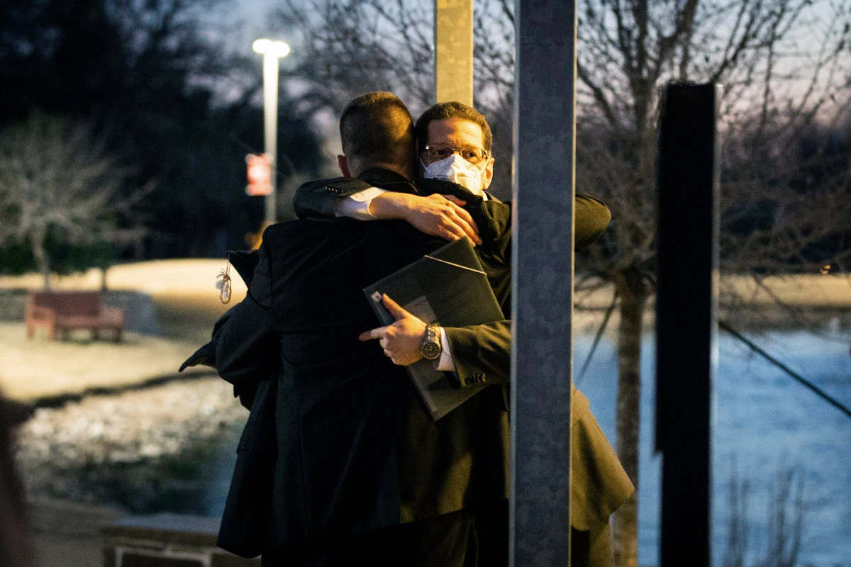 Rabbi Charlie Cytron-Walker hugs a man after a healing service Monday night, Jan. 17, 2022, at White's Chapel United Methodist Church in Southlake, Texas. (Star-Telegram via AP)