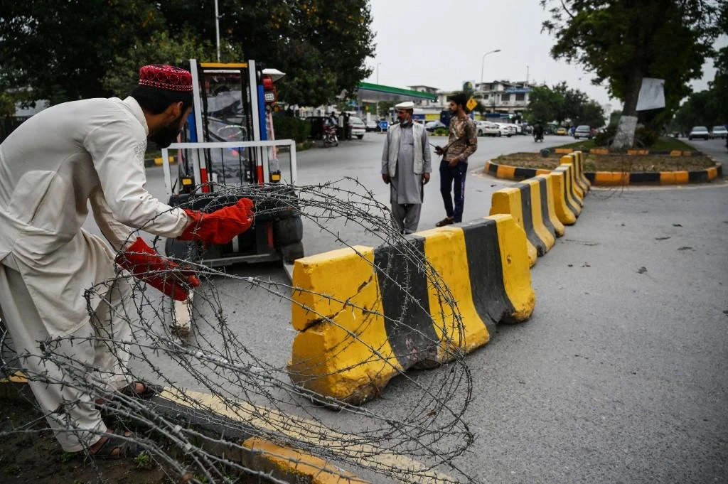 The firefight started when two gunmen of the outlawed Tehreek-e-Taliban Pakistan opened fire on a police checkpoint in central Islamabad. (AFP)