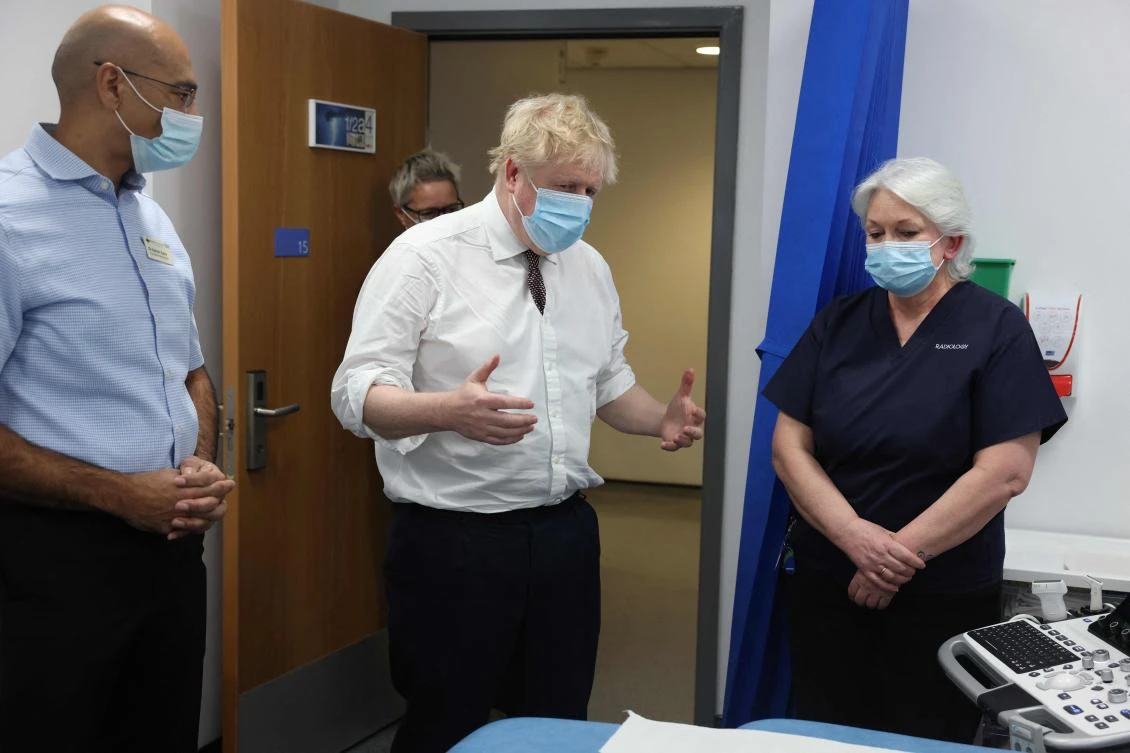 British Prime Minister Boris Johnson visits Finchley Memorial Hospital in North London on Tuesday. (AFP)