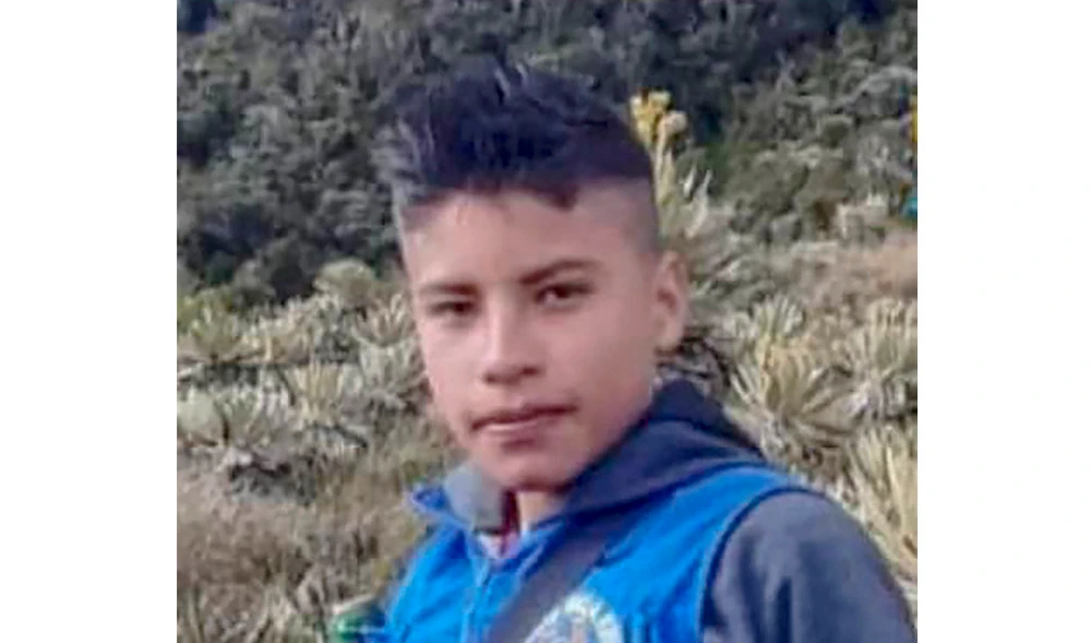 Handout picture released by indigenous group ACIN on January 18, 2022, showing Colombian 14-year-old environmental activist Breiner David Cucuname. (AFP)