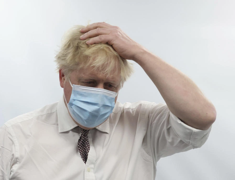 Britain's Prime Minister Boris Johnson gestures during a visit to Finchley Memorial Hospital, in North London, Tuesday, Jan. 18, 2022. (AP)