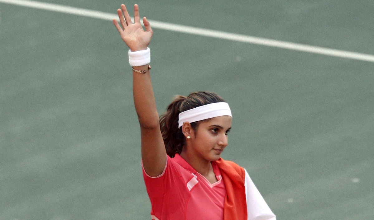 Indian tennis player Sania Mirza waves to her supporters during a match in Hyderabad, on November 25 2006. (AFP/File)