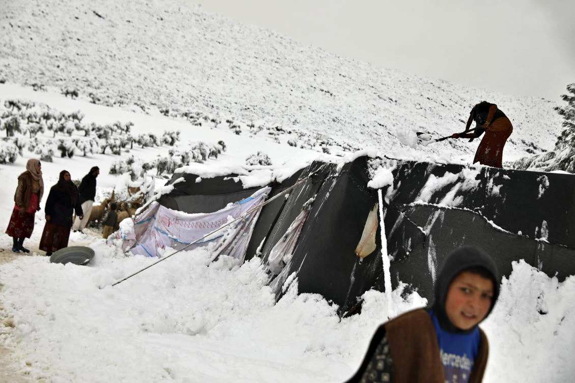 Impoverished Lebanese, Syrians struggle to survive cold