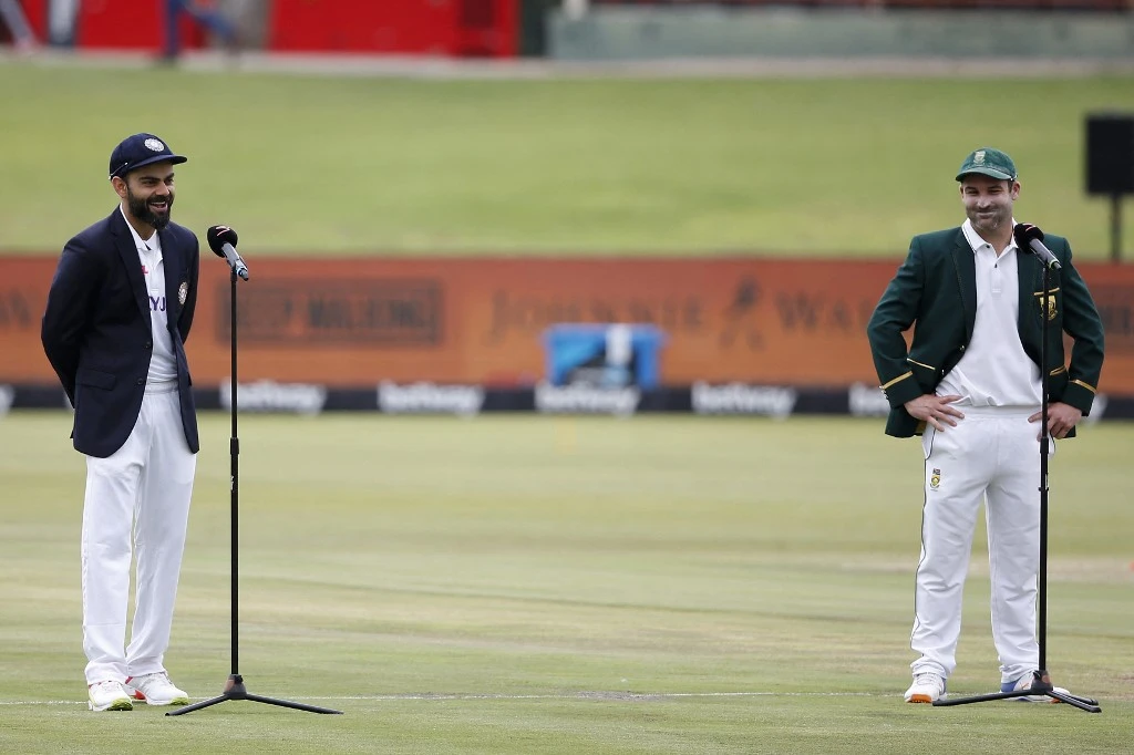 India’s captain Virat Kohli, left, and South Africa’s captain Dean Elgar speaks after doing the toss ahead of the the first day of the first Test cricket match between South Africa and India on Dec. 26, 2021. (AFP)