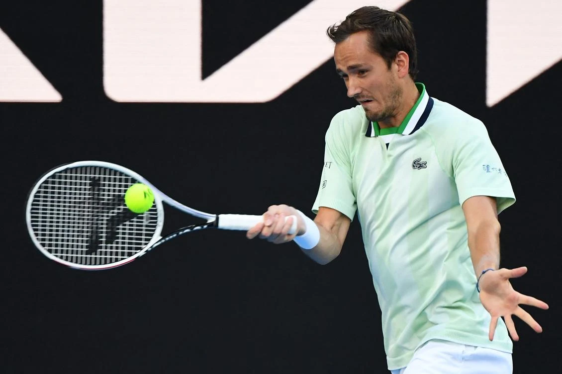 Russia's Daniil Medvedev hits a return against Australia's Nick Kyrgios during their men's singles match on day four of the Australian Open tennis tournament in Melbourne on Thursday. (AFP)
