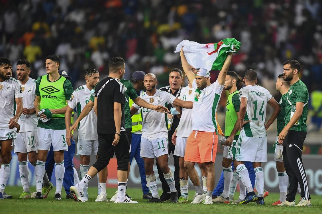 An Algerian supporter waves his country’s flag as he invades the pitch after Algeria’s Group E Africa Cup of Nations match against Ivory Coast at Stade de Japoma in Douala on Thursday. (AFP)