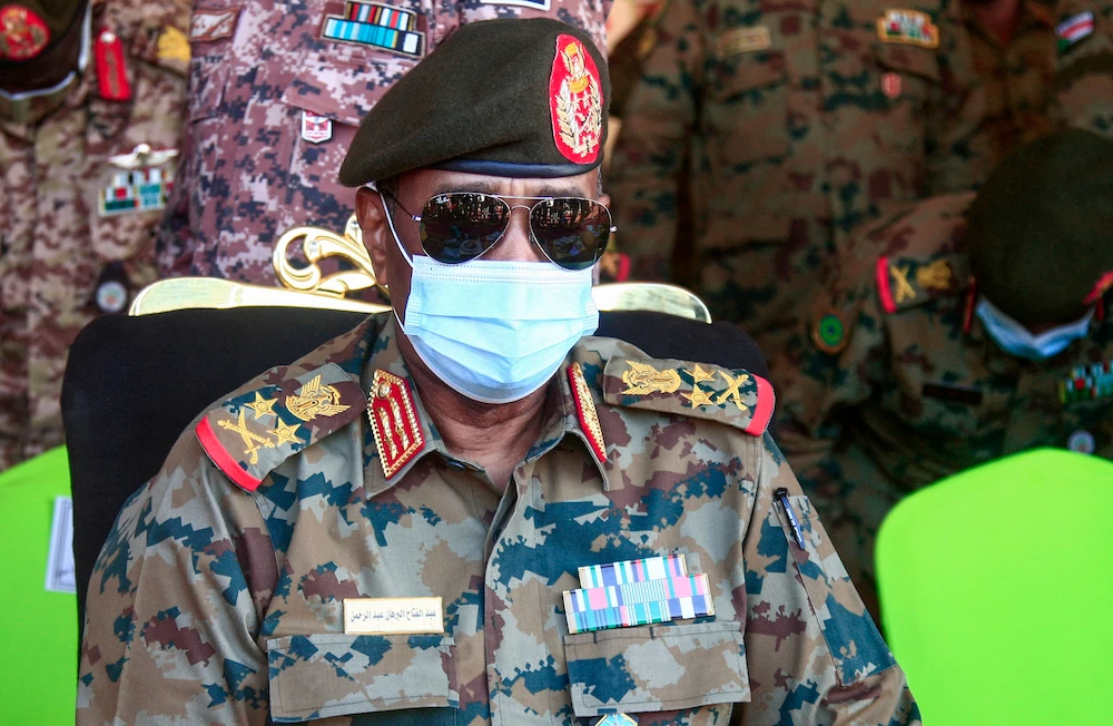 Sudan’s top general Abdel Fattah Al-Burhan speaks as he attends the conclusion of a military exercise in the Maaqil area in the northern Nile River State. (File/AFP)