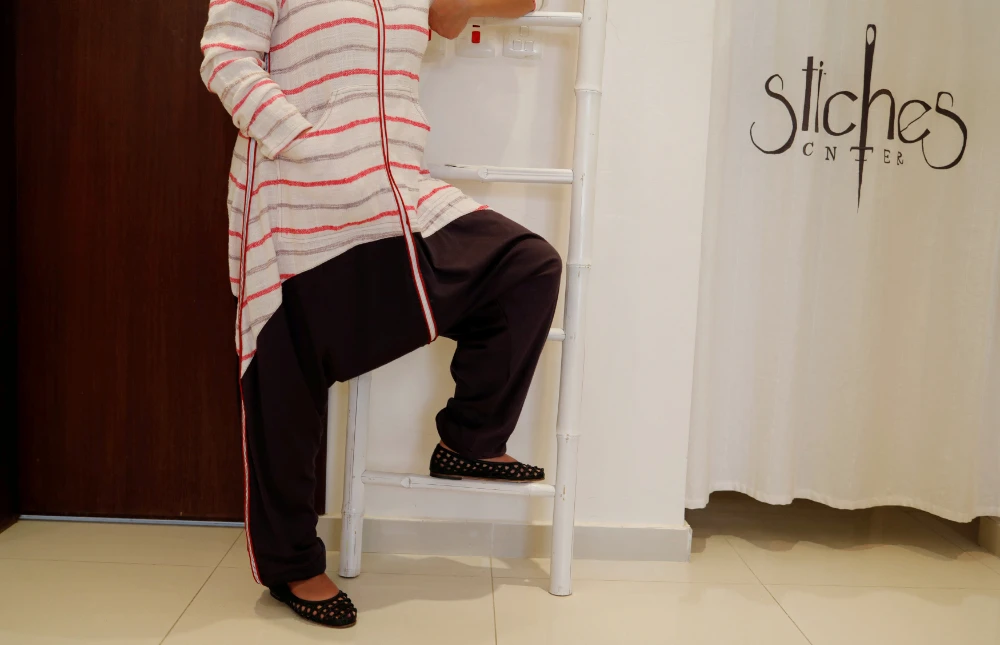 A fashion designer poses in one of her creations at her shop in Jeddah, Saudi Arabia. (REUTERS file photo)