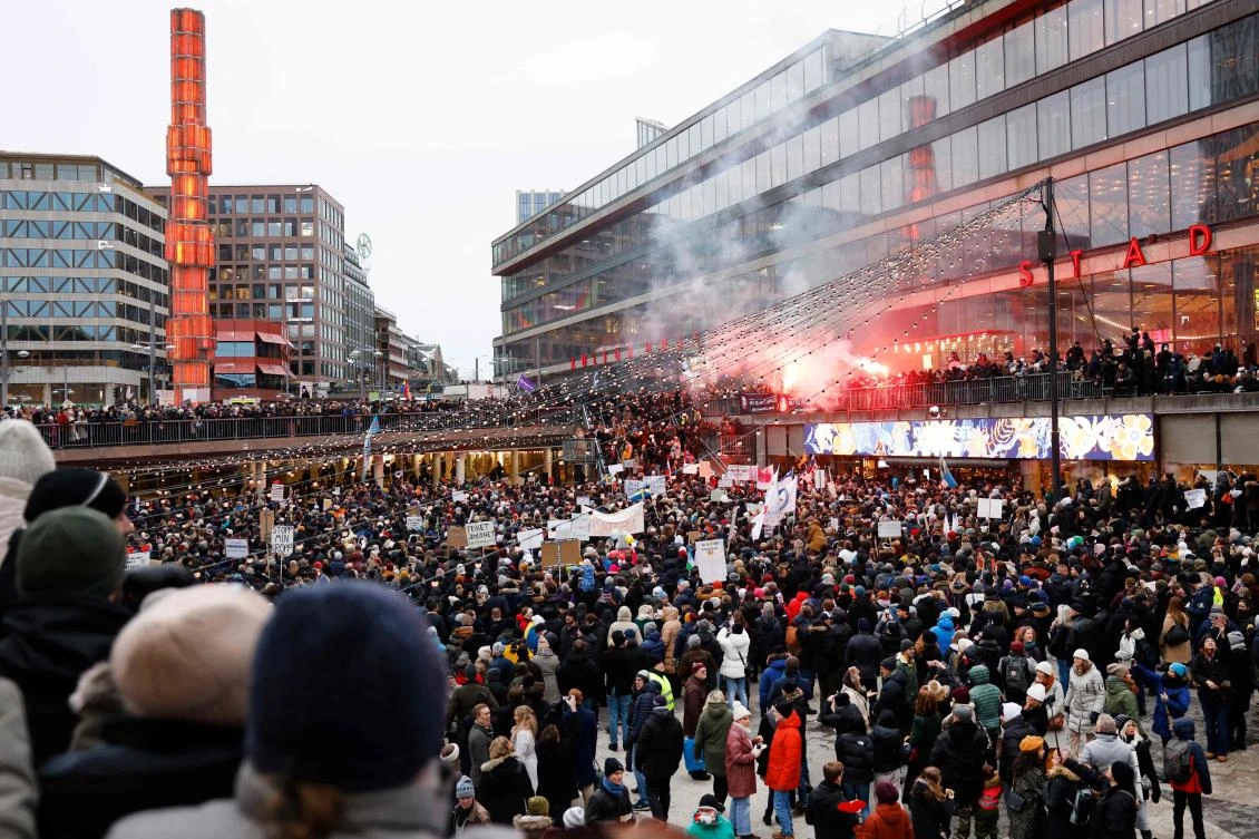 Anti-vaccine protesters take part in a demonstration under the motto "For a free Sweden without vaccine pass" in Stockholm, on Saturday. (AFP)