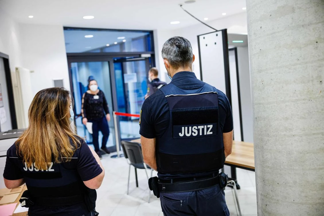 Justice officers secure access to the high security area at the District Court Halle (Justizzentrum) in Halle an der Saale, eastern Germany, on January 25, 2022, before the start of the trial against Leonora Messing. (AFP)