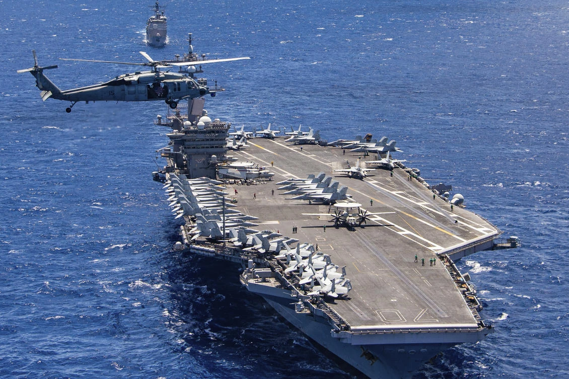 The pilot was able to eject before the aircraft slammed into the flight deck of the USS Carl Vinson, above, on Monday and then fell into the water. (US Navy via AP)